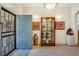 Bright foyer showcasing elegant tile flooring and a glass display case at 12 Canon Cir, Greenwood Village, CO 80111