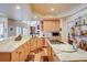 Open kitchen with updated appliances, granite counters, and a pass-through to the dining area at 12 Canon Cir, Greenwood Village, CO 80111