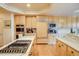 Stylish kitchen featuring integrated appliances and a chef's island with a gas cooktop at 12 Canon Cir, Greenwood Village, CO 80111