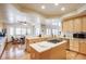 Gourmet kitchen with large island, granite counters, stainless appliances, and ample storage at 12 Canon Cir, Greenwood Village, CO 80111