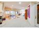 Open concept living area with hardwood floors and a view into the bright recreation space at 12 Canon Cir, Greenwood Village, CO 80111