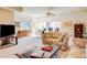 Bright living room includes comfortable seating, a tv, and exercise equipment at 12 Canon Cir, Greenwood Village, CO 80111