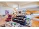 Spacious living room offering vaulted ceilings and an open layout with a view of the kitchen at 12 Canon Cir, Greenwood Village, CO 80111