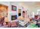 Inviting living room with a fireplace, vaulted ceilings, built-in shelves and comfortable seating at 12 Canon Cir, Greenwood Village, CO 80111
