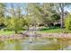 Beautiful community grounds feature a serene pond with a fountain, lush landscaping, and walking paths at 12 Canon Cir, Greenwood Village, CO 80111