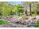 Scenic landscape featuring a rocky stream and a serene pond, adding natural beauty to the community at 12 Canon Cir, Greenwood Village, CO 80111