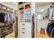 Well-organized walk-in closet featuring shelves, drawers, hanging rods, and ample storage space for clothing and shoes at 12 Canon Cir, Greenwood Village, CO 80111