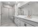 Bright bathroom with double vanity, frameless shower, and modern fixtures at 2347 Kite Route Ln, Superior, CO 80027