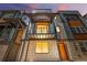 Modern three-story townhome with a metal balcony and a combination of siding and stone accents at 2347 Kite Route Ln, Superior, CO 80027