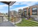 Community with modern townhomes overlooking a common lawn area and green spaces at 2347 Kite Route Ln, Superior, CO 80027