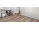 Hallway with hardwood floors, a staircase, and double doors at 2347 Kite Route Ln, Superior, CO 80027