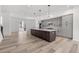 Spacious kitchen with gray cabinets, stainless appliances, and a large island perfect for entertaining at 2347 Kite Route Ln, Superior, CO 80027