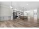 Bright open kitchen featuring gray cabinets, stainless steel appliances, and a large center island at 2347 Kite Route Ln, Superior, CO 80027