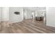 Spacious living room area with hardwood floors and access to the kitchen area at 2347 Kite Route Ln, Superior, CO 80027