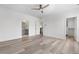 Spacious main bedroom featuring a ceiling fan, walk-in closet, and access to the bathroom at 2347 Kite Route Ln, Superior, CO 80027