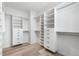 Organized walk-in closet system with shelving, drawers, and hanging racks for optimal storage at 2347 Kite Route Ln, Superior, CO 80027