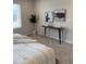 Bright bedroom with a modern table, stylish decorations, and an inviting king-size bed at 7306 Watercress Dr, Littleton, CO 80125