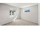 Neutral carpeted bedroom with two windows providing natural light at 7306 Watercress Dr, Littleton, CO 80125