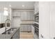 Contemporary kitchen highlighting granite counters, stainless steel appliances, and ample cabinet space at 7306 Watercress Dr, Littleton, CO 80125