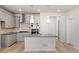 Well-equipped kitchen featuring stainless steel appliances, granite countertops, and pendant lighting at 7306 Watercress Dr, Littleton, CO 80125