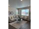 Inviting living room with a comfortable sofa, chairs, and a stylish area rug at 7306 Watercress Dr, Littleton, CO 80125