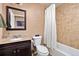 Bathroom featuring a single sink vanity and a tub and shower combination at 16486 W 94Th Dr, Arvada, CO 80007
