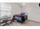 Cozy bedroom featuring a bed, desk, and natural light from the window at 16486 W 94Th Dr, Arvada, CO 80007