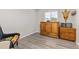 Bedroom with wood-look flooring and modern decor at 16486 W 94Th Dr, Arvada, CO 80007