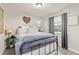 Bedroom featuring natural light, wood-look flooring and view at 16486 W 94Th Dr, Arvada, CO 80007