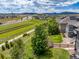 Neighborhood with scenic walking path, adjacent to green spaces with mountain views in the distance at 16486 W 94Th Dr, Arvada, CO 80007