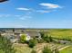 Picturesque neighborhood view with lush greenery and open spaces, offering beautiful city skyline vistas at 16486 W 94Th Dr, Arvada, CO 80007