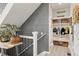 Upstairs hallway featuring mud room, with coat hooks and basket storage at 16486 W 94Th Dr, Arvada, CO 80007