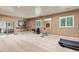Bright home gym area with ample space for equipment and a view from the windows at 16486 W 94Th Dr, Arvada, CO 80007
