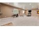 Bright home gym area with ample space for equipment and a view from the windows at 16486 W 94Th Dr, Arvada, CO 80007