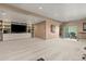 Spacious living room with recessed lighting, neutral carpet and a custom built-in entertainment center at 16486 W 94Th Dr, Arvada, CO 80007