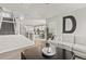 Open-concept living area with a staircase, modern decor, and seamless transition to the kitchen at 16486 W 94Th Dr, Arvada, CO 80007