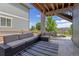 Outdoor patio featuring comfortable seating, a stylish rug, and ample space for entertaining at 16486 W 94Th Dr, Arvada, CO 80007