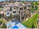 Luxury home with stone exterior and large backyard at 10887 Rainribbon Rd, Highlands Ranch, CO 80126