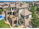 Luxury home with stone exterior and expansive backyard at 10887 Rainribbon Rd, Highlands Ranch, CO 80126