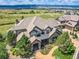 Luxury home with mountain views, landscaped grounds, and a large backyard at 10887 Rainribbon Rd, Highlands Ranch, CO 80126