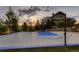 Outdoor basketball court with sunset view at 10887 Rainribbon Rd, Highlands Ranch, CO 80126