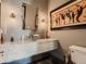 Spa-like powder room with a unique vessel sink and modern fixtures at 10887 Rainribbon Rd, Highlands Ranch, CO 80126