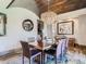 Elegant dining room features a crystal chandelier and hardwood floors at 10887 Rainribbon Rd, Highlands Ranch, CO 80126