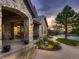 Stone exterior with a welcoming porch and landscaping at 10887 Rainribbon Rd, Highlands Ranch, CO 80126