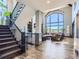 Modern staircase with metal railing and hardwood floors at 10887 Rainribbon Rd, Highlands Ranch, CO 80126