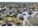 Aerial view of home, featuring a detached garage, driveway, and surrounding neighborhood at 45 S Grove St, Denver, CO 80219