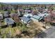 Aerial view of the home showcasing a detached garage and fenced backyard in a residential neighborhood at 45 S Grove St, Denver, CO 80219