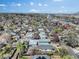 Wide aerial view showcases the home, surrounding neighborhood, mature trees, and city skyline at 45 S Grove St, Denver, CO 80219