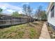 Landscaped backyard featuring a wooden fence and greenery, creating a private outdoor space at 45 S Grove St, Denver, CO 80219