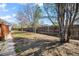 Large backyard with wooden fence, offering privacy and plenty of space for outdoor activities at 45 S Grove St, Denver, CO 80219
